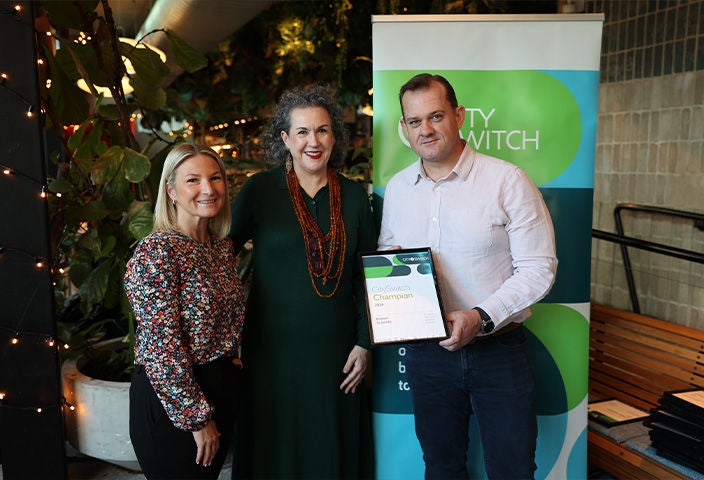 Two women and one men holding cityswitch 2024 award and giving pose for picture.