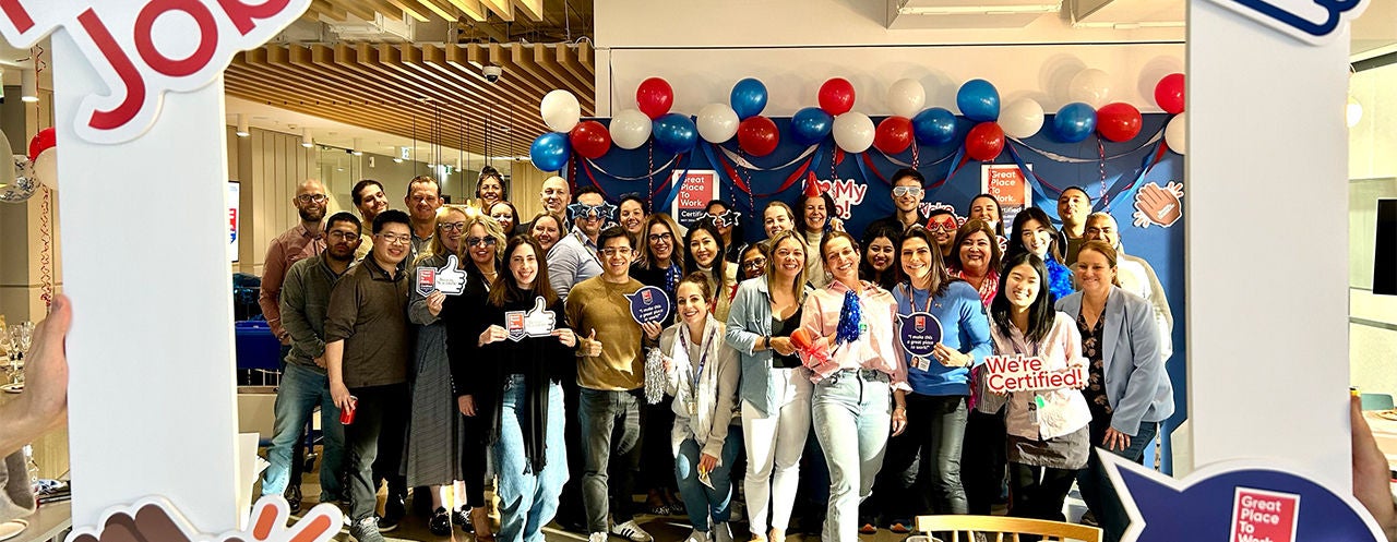 Group photo of smiling Boston Scientific employees celebrating great place to work award.