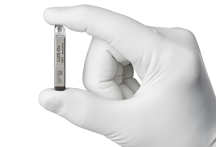 Close up image of Boston Scientific Lux-DX device holding in hand.