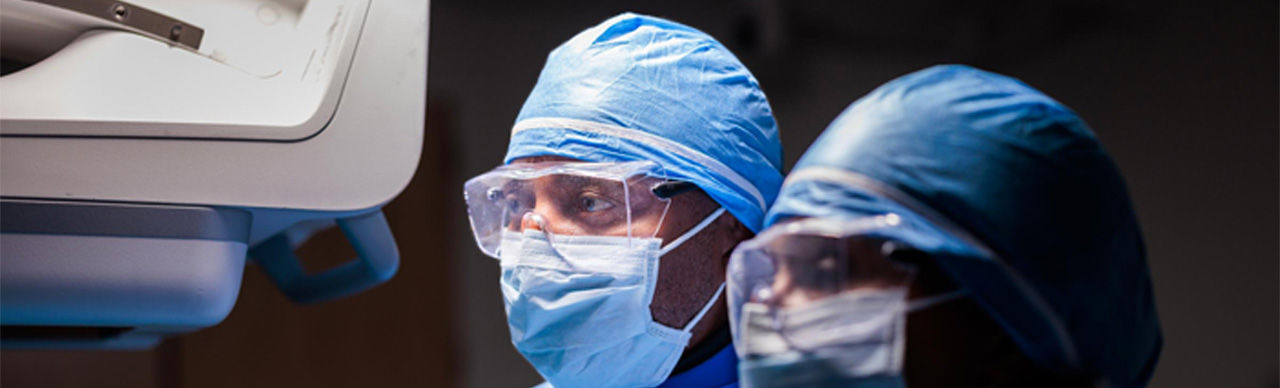 Two physican in mask inside operation theater.